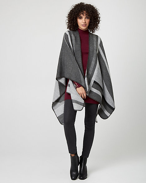 Le Chateau - Colour block styling lends a bold, contemporary look to a woven poncho. Woven. Open-front, sleeveless. Poncho, uneven hem. 95% Acrylic 5% Polyester. Imported.